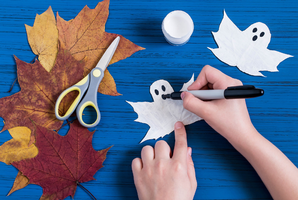 Once the paint is completely dry, use the marker to draw in eyes and a mouth