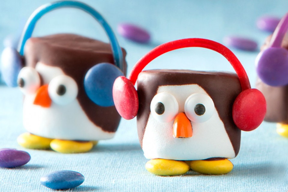 SMARTIES Penguins recipe. These cute marshmallow penguins are covered in melted chocolate and decorated with SMARTIES pieces.